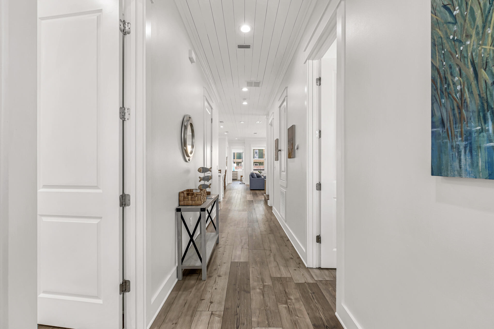 80 Sunfish Street Destin, FL 32541 - Photo 20 of 51 a view of a hallway with wooden floor and staircase