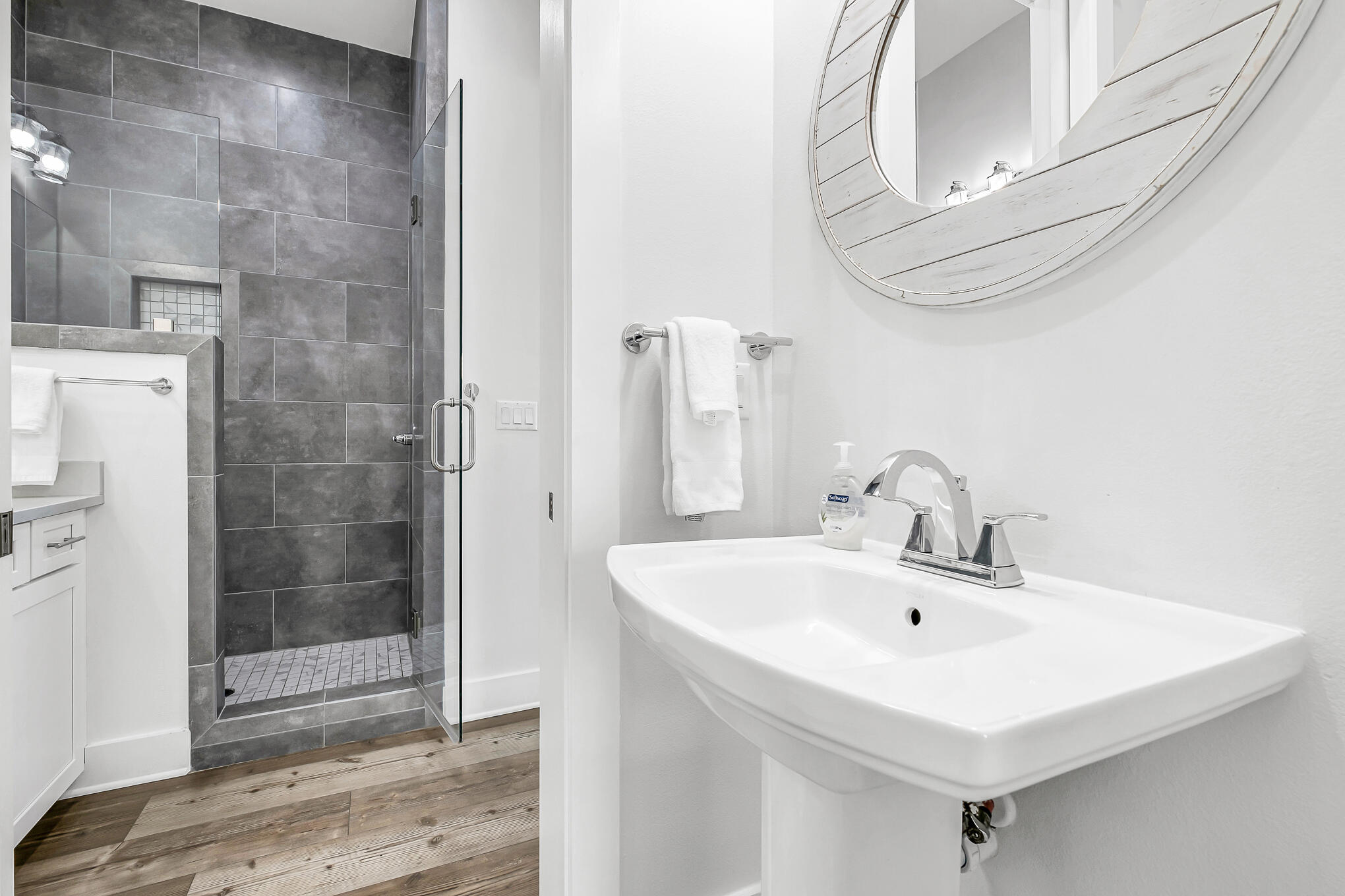 80 Sunfish Street Destin, FL 32541 - Photo 28 of 51 a bathroom with a sink a mirror and shower