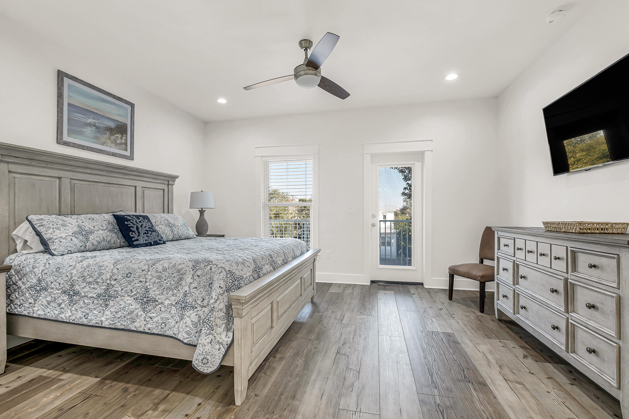 80 Sunfish Street Destin, FL 32541 - Photo 30 of 51 a spacious bedroom with a bed and a flat tv screen on dresser