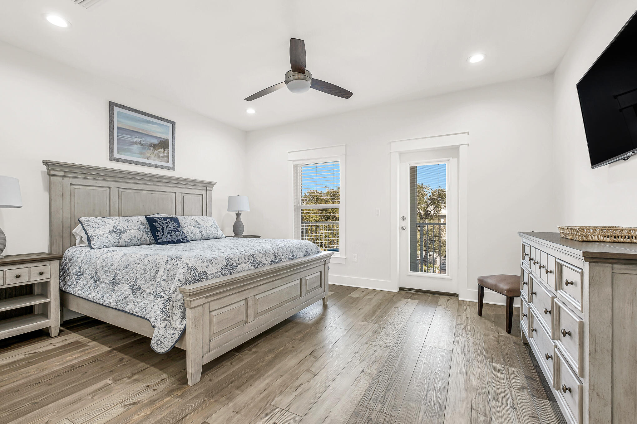 80 Sunfish Street Destin, FL 32541 - Photo 31 of 51 a bedroom with a large bed and a flat tv screen on dresser