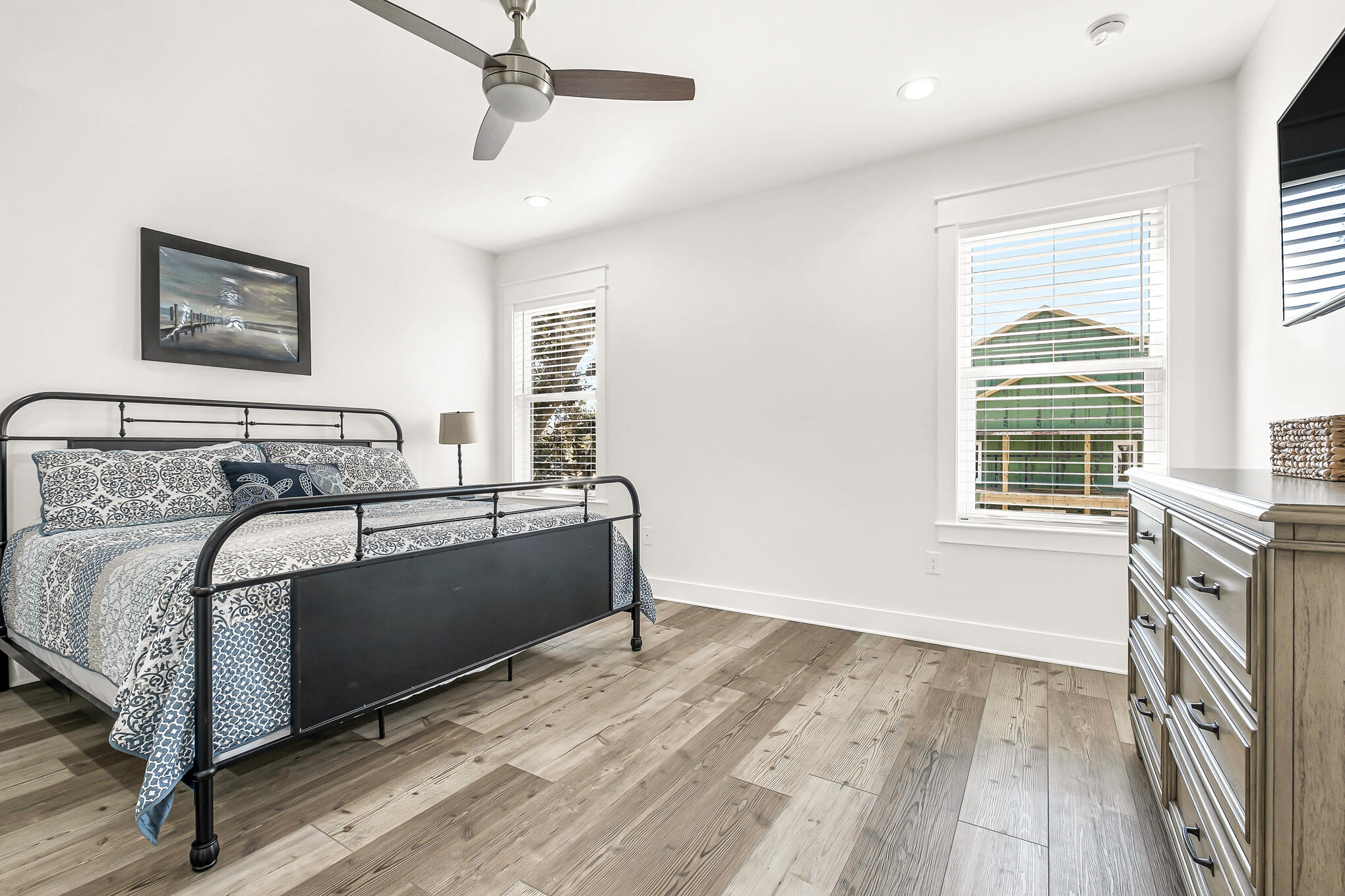 80 Sunfish Street Destin, FL 32541 - Photo 46 of 51 a bedroom with a bed and wooden floor