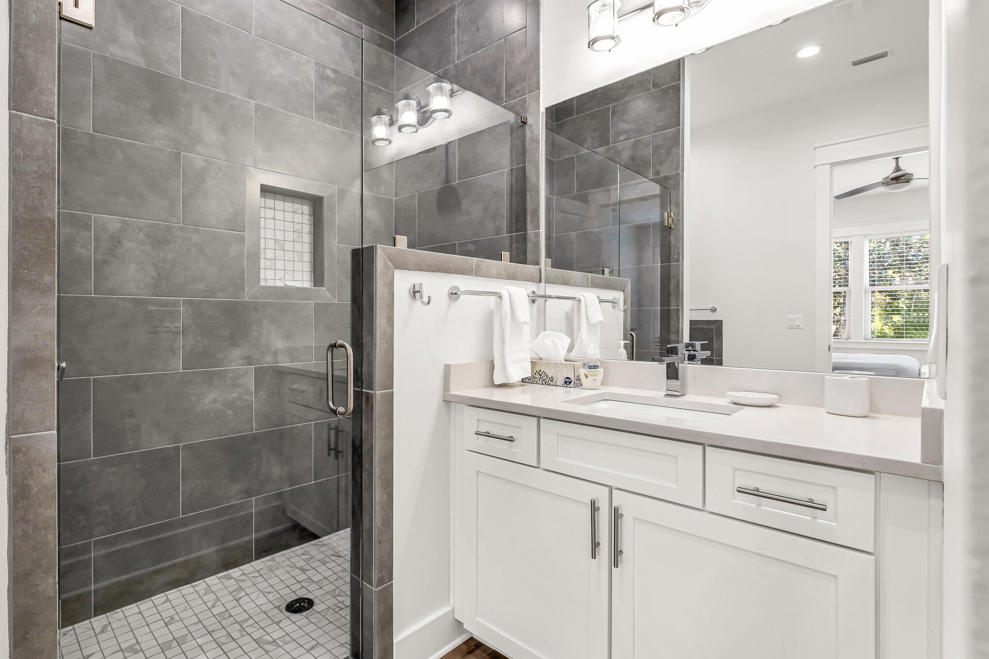 80 Sunfish Street Destin, FL 32541 - Photo 48 of 51 a bathroom with a sink shower and a mirror