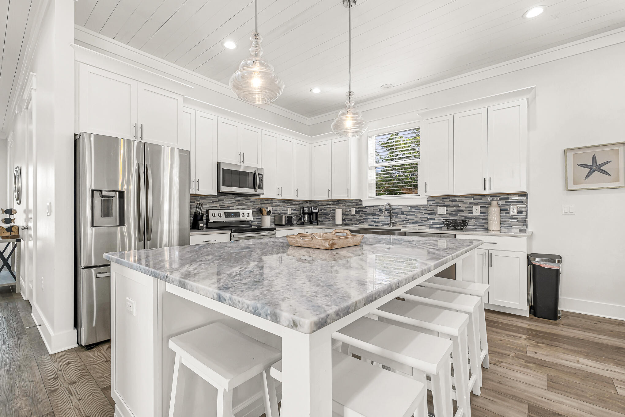 80 Sunfish Street Destin, FL 32541 - Photo 8 of 51 a kitchen with stainless steel appliances granite countertop a sink refrigerator and microwave
