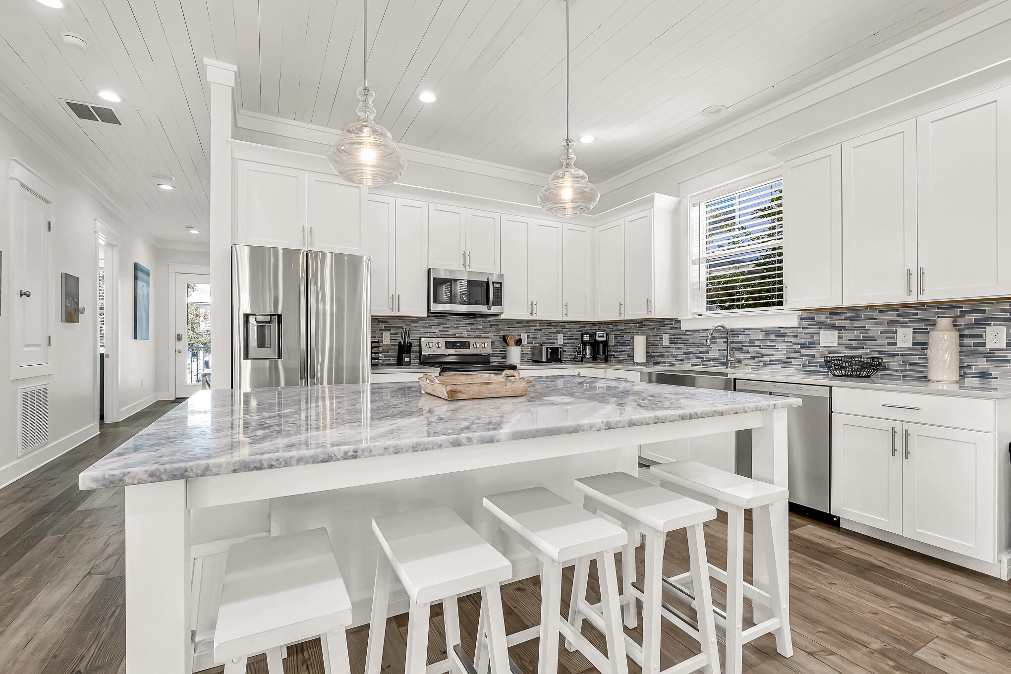 80 Sunfish Street Destin, FL 32541 - Photo 10 of 51 a kitchen with stainless steel appliances granite countertop a kitchen island a stove a cabinets a sink and a granite counter tops