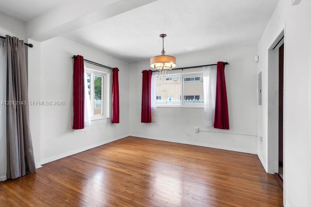 5651 Northwest 3rd Street Miami, FL 33126 - Photo 5 of 21 a very nice looking room with wooden floor and a window