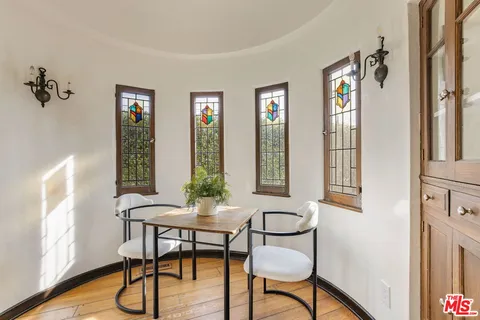 a view of a livingroom with furniture window and wooden floor
