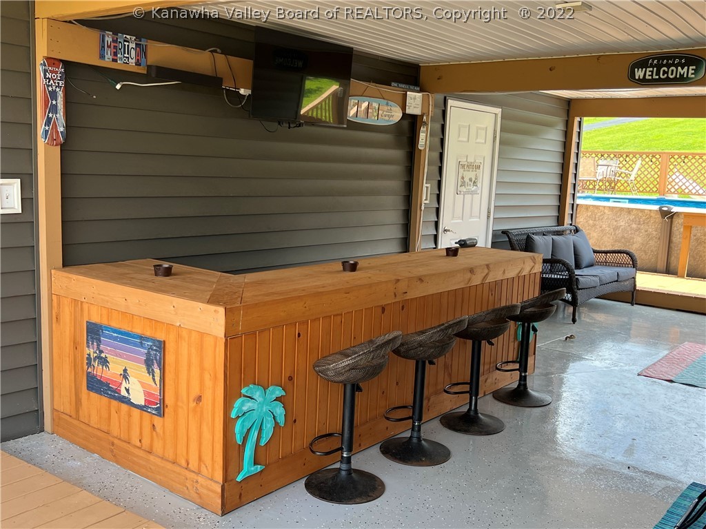13661 Ripley Road Point Pleasant, WV 25550 - Photo 29 of 44 BREEZEWAY W/BAR OPEN TO POOL AREA