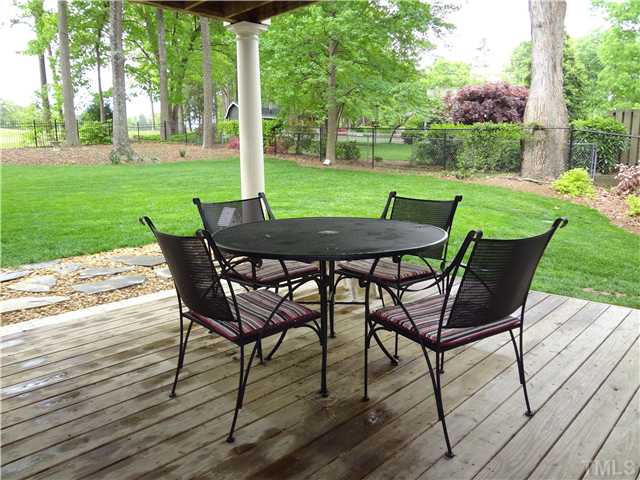 1604 Hunting Ridge Road Raleigh, NC 27615 - Photo 24 of 25 a view of a backyard with table and chairs
