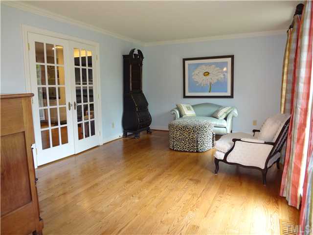 1604 Hunting Ridge Road Raleigh, NC 27615 - Photo 7 of 25 a living room with furniture rug and a window