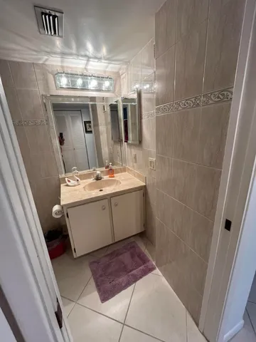 a view of living room and balcony with furniture