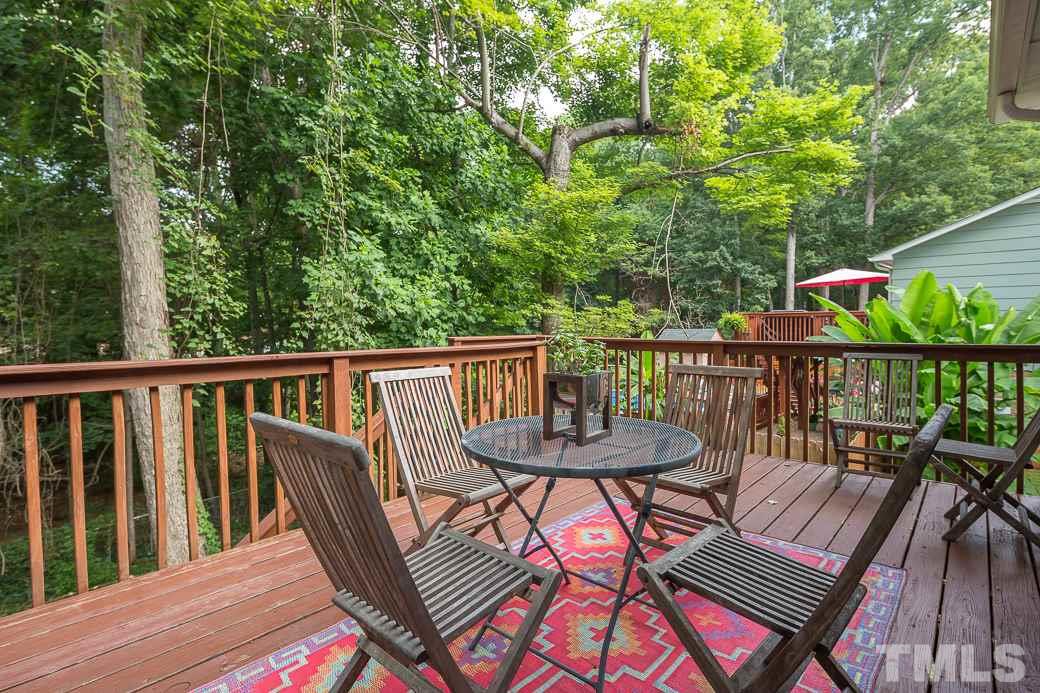 7625 Mine Valley Road Raleigh, NC 27615 - Photo 10 of 10 Serenity and sunshine can be enjoyed on the PRIVATE and large deck overlooking gorgeous hardwood trees and the FENCED IN YARD.