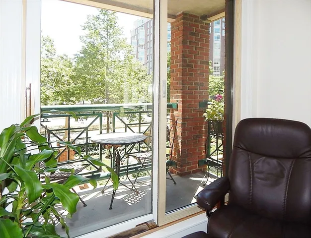 a view of a balcony with chairs