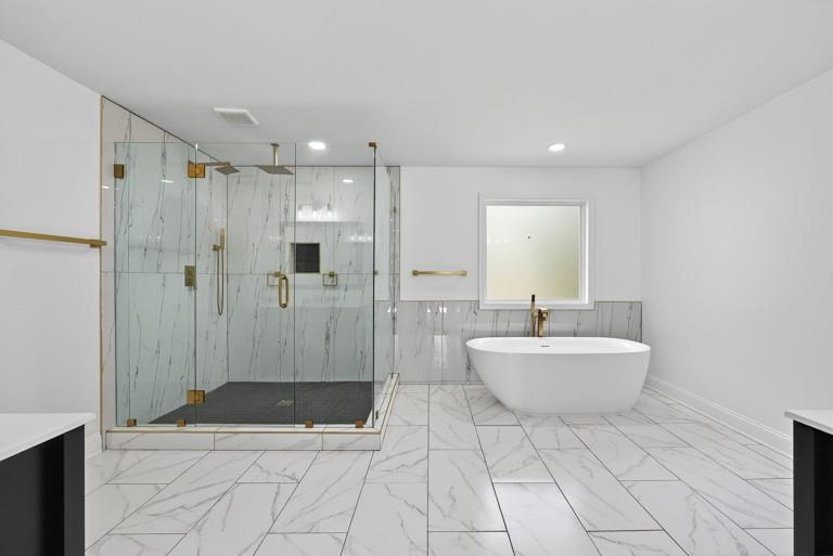 2177 Kipling Circle Southeast Atlanta, GA 30315 - Photo 17 of 27 a bathroom with a sink a toilet a mirror and shower