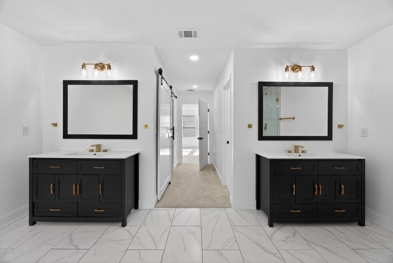 2177 Kipling Circle Southeast Atlanta, GA 30315 - Photo 19 of 27 a spacious bathroom with a sink vanity and a mirror