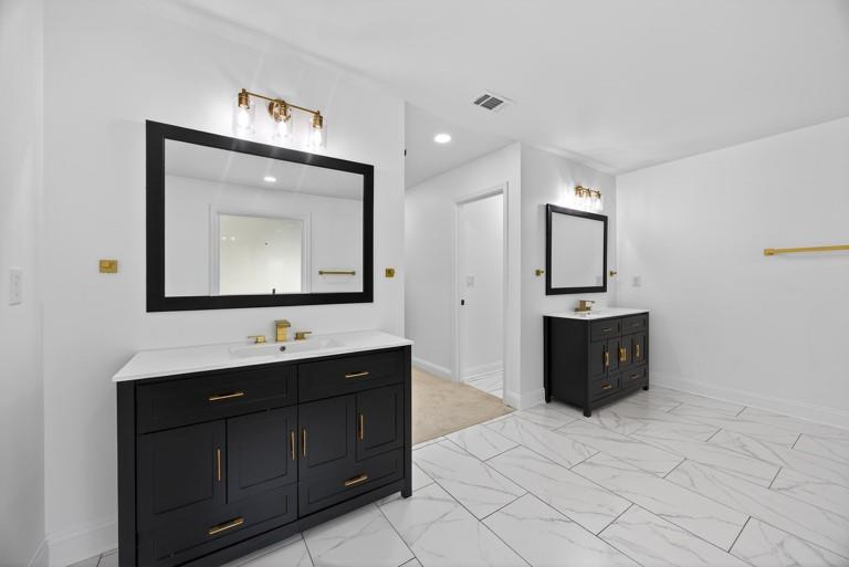 2177 Kipling Circle Southeast Atlanta, GA 30315 - Photo 20 of 27 a bathroom with a toilet sink and mirror