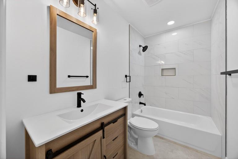2177 Kipling Circle Southeast Atlanta, GA 30315 - Photo 22 of 27 a bathroom with a sink a toilet and shower