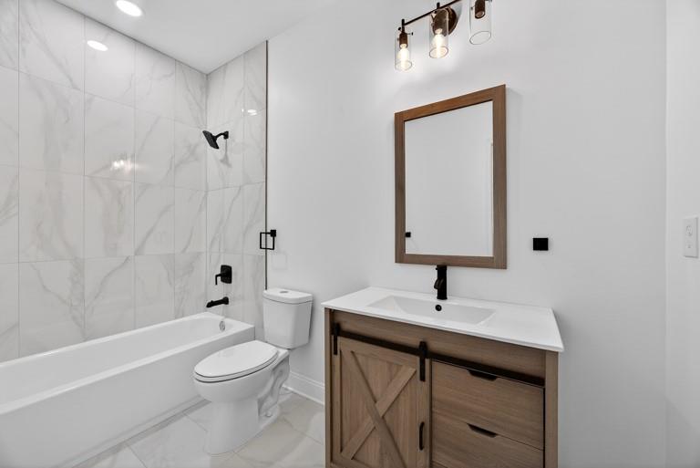 2177 Kipling Circle Southeast Atlanta, GA 30315 - Photo 23 of 27 a bathroom with a sink a toilet and shower