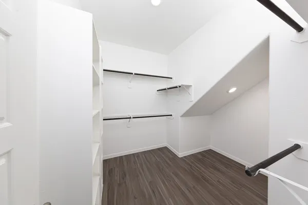 a view of an empty walk in closet
