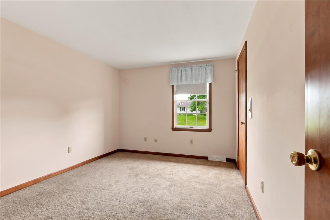 6090 Stone Post Road Bath, PA 18014 - Photo 36 of 57 Well-lit room with plush carpeting offers tranquil views of the surrounding green landscape.