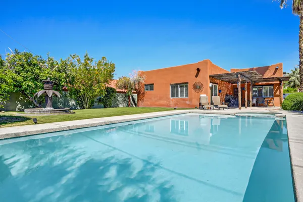 a front view of a house with swimming pool
