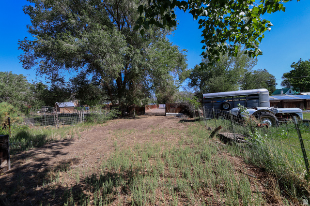 270 East 100 North Monroe, UT 84754 - Photo 63 of 65 Expansive outdoor space featuring mature trees and a clear blue sky