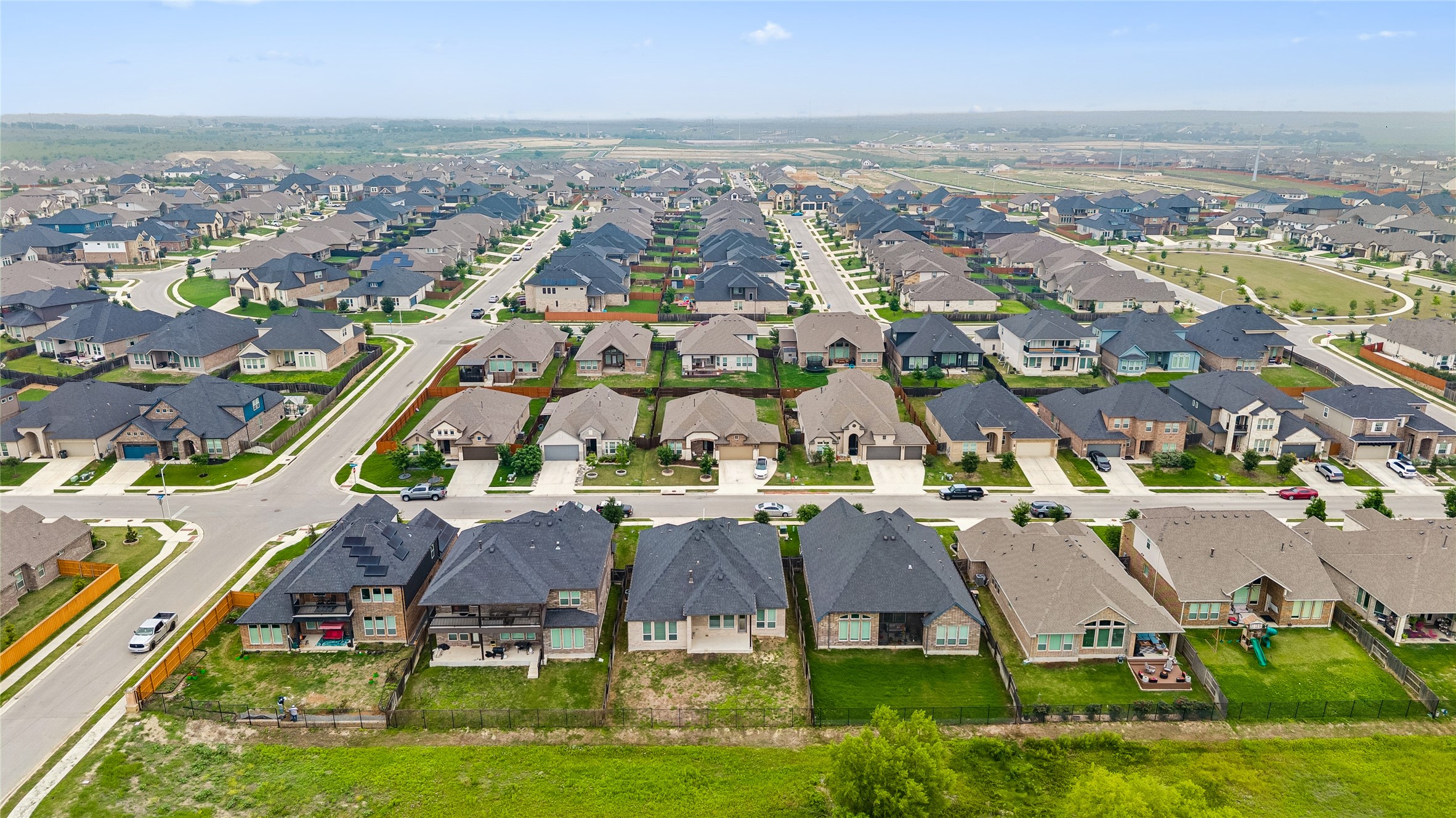 298 Wild Pecan Loop Buda, TX 78610 - Photo 36 of 40 an aerial view of residential houses with outdoor space
