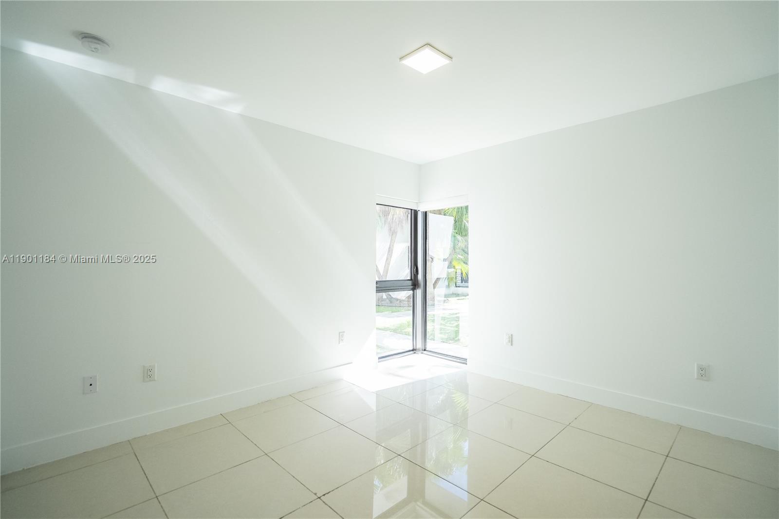 1985 Bay Drive, Unit 111 Miami Beach, FL 33141 - Photo 13 of 20 an empty room with windows and closet