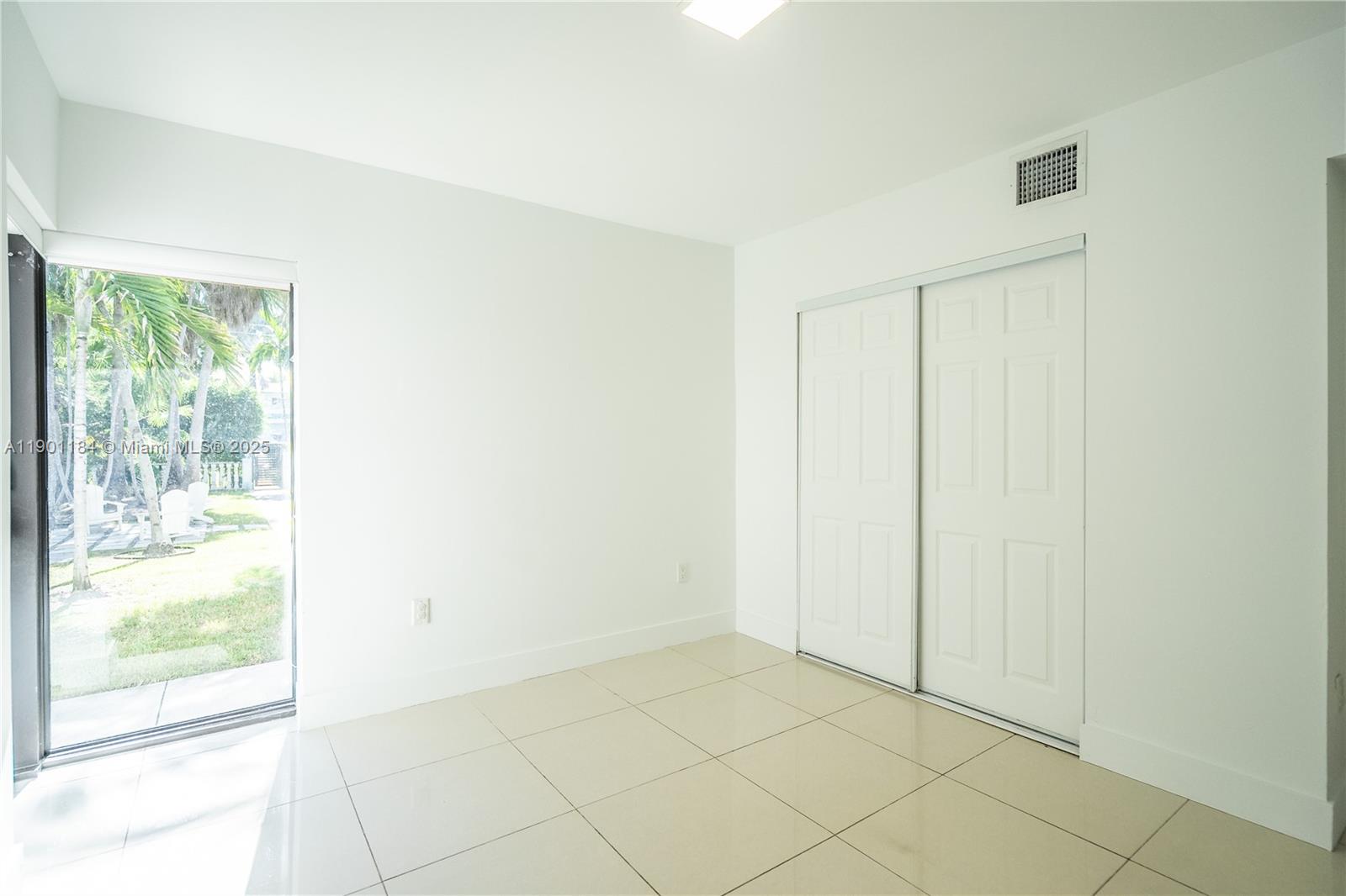 1985 Bay Drive, Unit 111 Miami Beach, FL 33141 - Photo 16 of 20 a view of an empty room and window