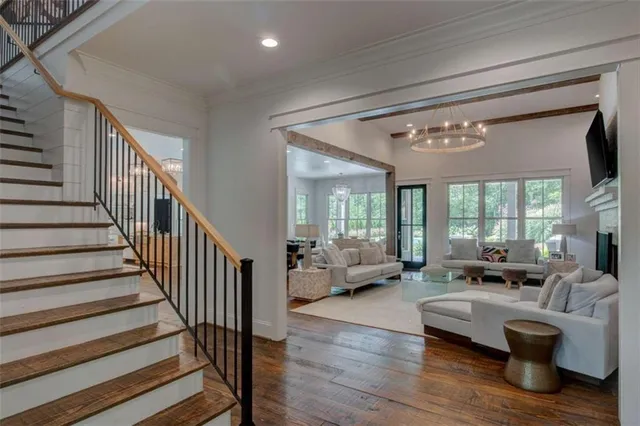 a living room with furniture and wooden floor
