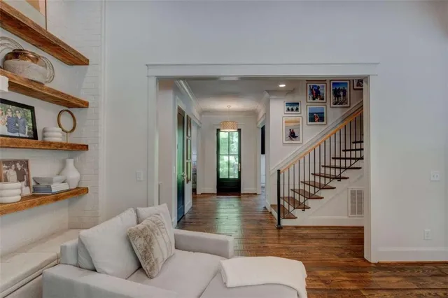 a kitchen with stainless steel appliances granite countertop a stove a refrigerator and a white cabinets