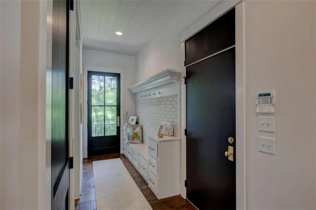 a bathroom with a toilet a sink and a mirror