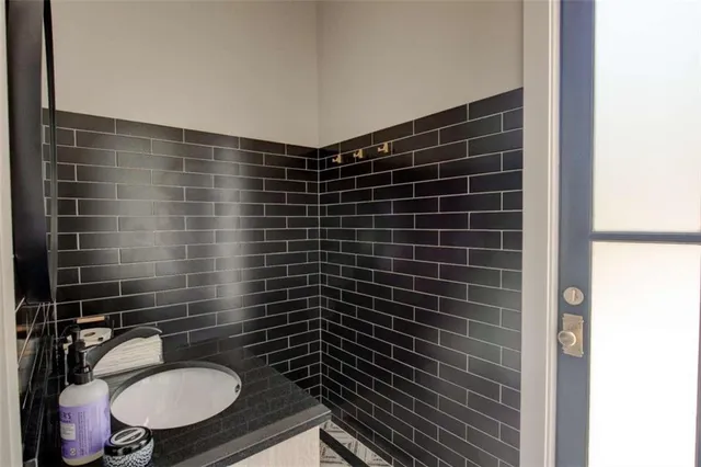 a bedroom with a bed and a chair