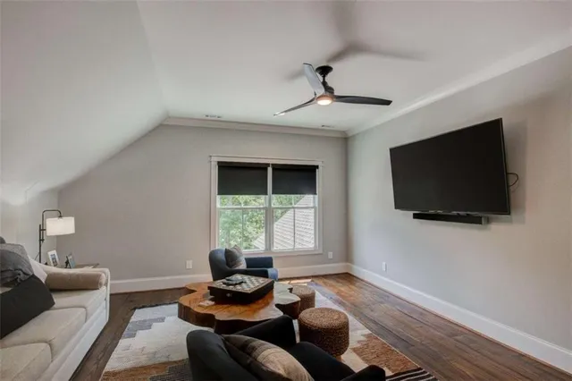 an aerial view of residential house with outdoor space and trees all around