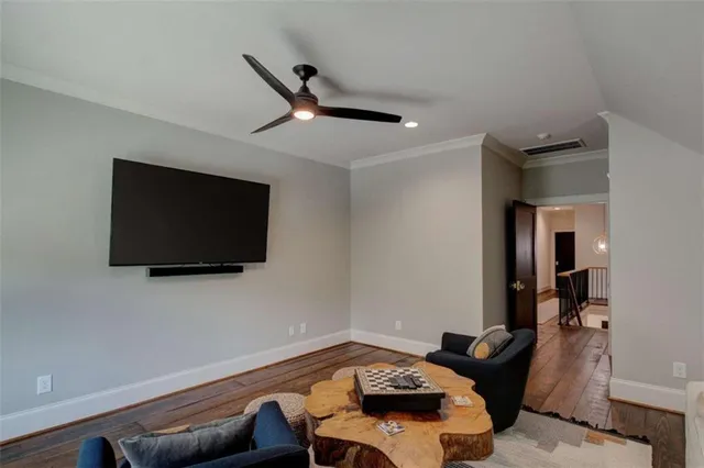 an aerial view of residential house with outdoor space and trees all around