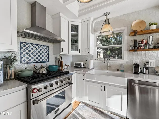 a kitchen with a stove and a sink