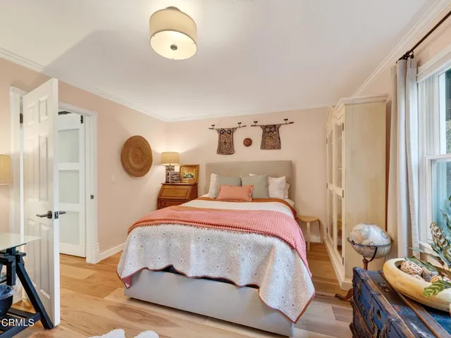 a view of a workspace with furniture and a flat screen tv