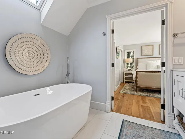a kitchen with cabinets and window