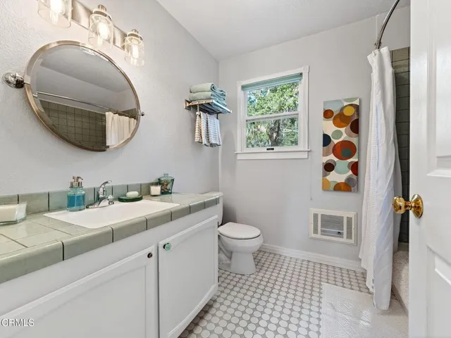 a view of balcony with two chairs and potted plants