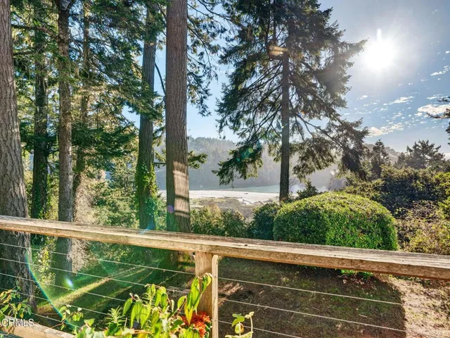 a balcony with furniture and wooden floor