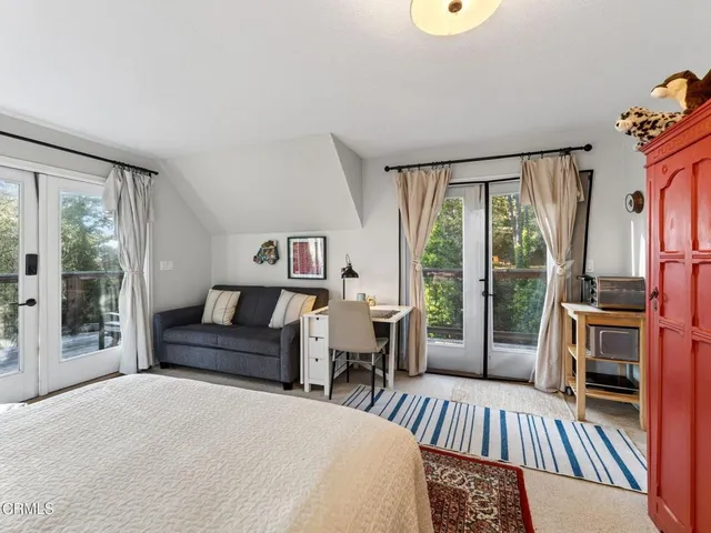 a view of a two chairs in the balcony