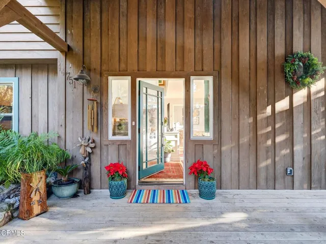a very nice looking living room with furniture and a large window