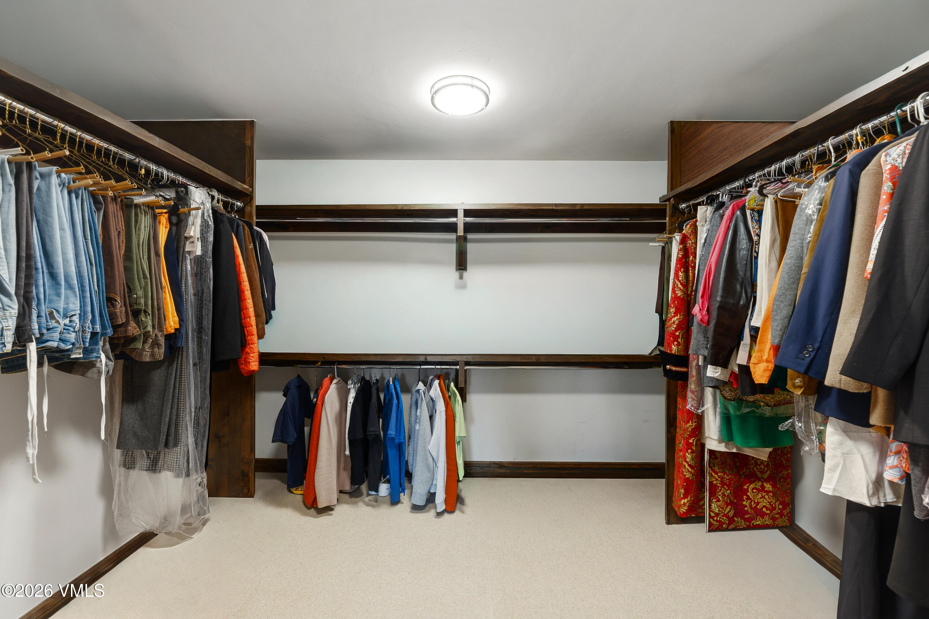 91 Edwards Pointe Edwards, CO 81632 - Photo 19 of 39 a view of walk in closet with clothes and shoes