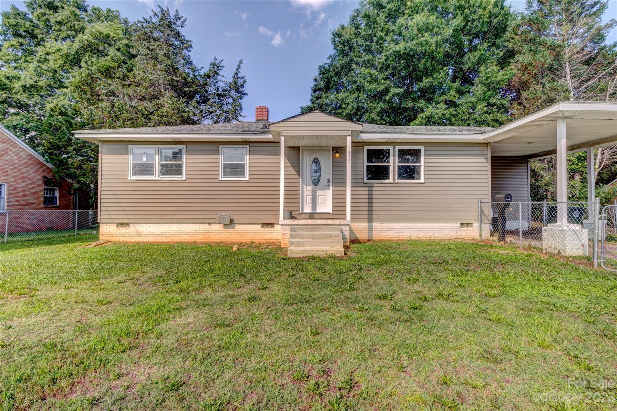 402 Delview Road Cherryville, NC 28021 - Photo 2 of 11 a front view of a house with a yard