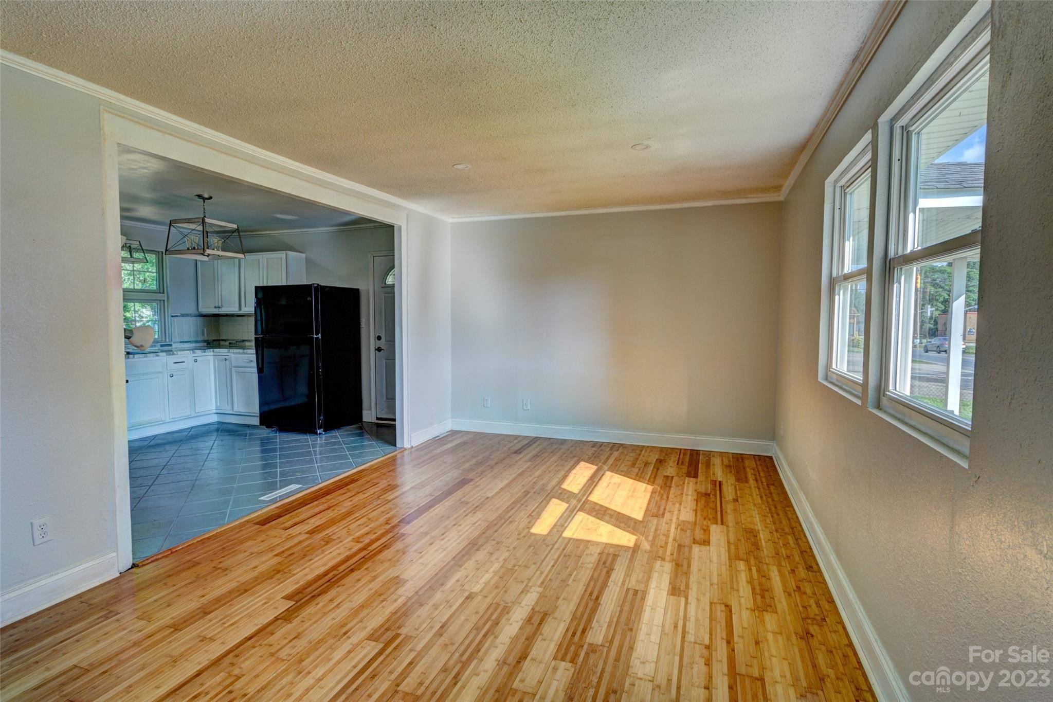 402 Delview Road Cherryville, NC 28021 - Photo 3 of 11 wooden floor in an empty room with a window