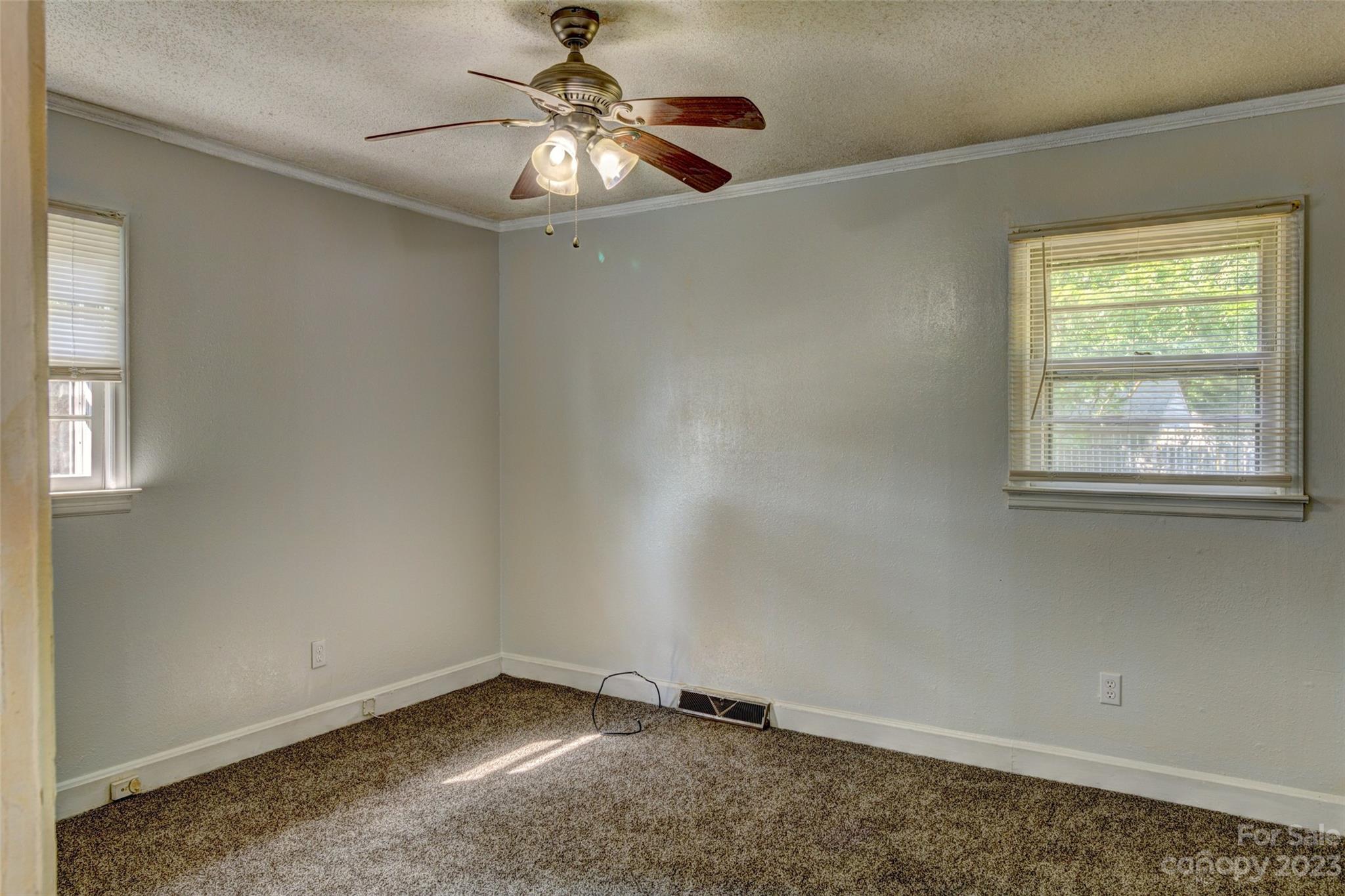 402 Delview Road Cherryville, NC 28021 - Photo 9 of 11 an empty room with a window and a fan