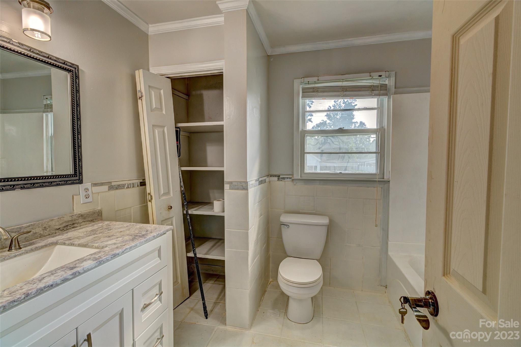 402 Delview Road Cherryville, NC 28021 - Photo 10 of 11 a bathroom with a granite countertop toilet sink and mirror