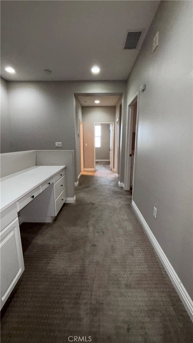 201 Sklar Street Ladera Ranch, CA 92694 - Photo 28 of 35 Hallway to laundry room, secondary bedrooms and bath on upper level