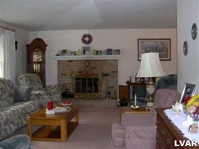 4017 Blacksmith Road New Tripoli, PA 18066 - Photo 5 of 12 BEAUTIFUL BRICK FIREPLACE IN LIVING ROOM.