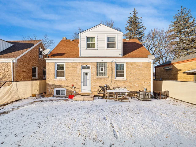 a front view of a house with many windows