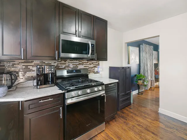 a kitchen with a stove and a microwave